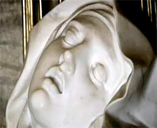 Detail of the marble sculpture, Ecstasy of St. Teresa, by Gian Lorenzo Bernini (1598-1680). An outstanding architect and perhaps the greatest sculptor of the 17th century, Bernini originated the Baroque style of sculpture - of which his Ecstasy of St. Teresa (created 1647-52) is a primary example. Screen capture from "Why Beauty Matters."