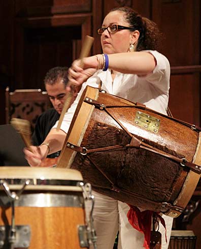Clara Alvear playing her bombo drum. Photograph by Mark Vallen ©.
