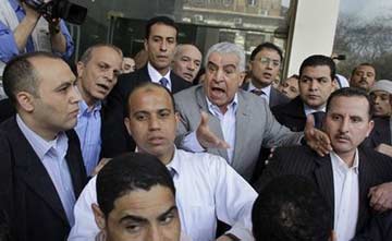 AP photo by Ben Curtis Minister of Antiquities, Zahi Hawass, argues with state museum workers as they protest outside of the Supreme Council of Antiquities on Feb. 9, 2011. AP Photo/Ben Curtis.