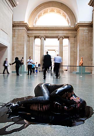 A protestor from the U.K. activist group, Liberate Tate, stages an intervention titled "Human Cost" at the Tate Britain on Wednesday April 20, 2011. Photo: anonymous.