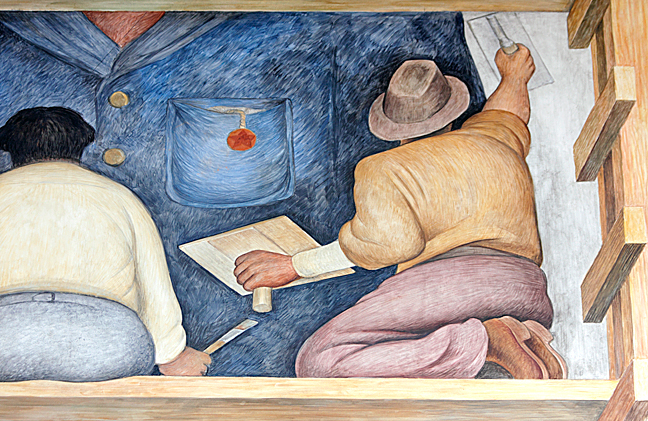 Since it was to be painted in an art school, Rivera decided that his mural would show the actual process of creating a fresco mural. In this detail he depicted himself sitting next to an assistant, who is covering the wall with fresh limestone plaster for the artist to paint. Photo/Mark Vallen ©