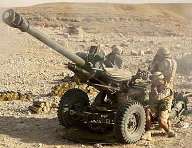 British soldiers in Afghanistan firing a 105mm round at Taliban fighters from their "Dragon" L118 Light Gun. Photo by Sergeant Anthony Bookock for the U.K. Ministry of Defense/© Crown Copyright/MOD 2008.