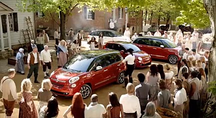"The 'Director's Cut' ad culminates with Paul Revere and the FIAT 500Ls entering the town center while a crowd of colonials gather to gawk." Screenshot from Fiat's "Italian Invasion" commercial.