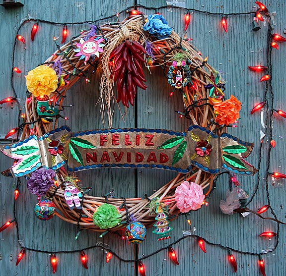  "Feliz Navidad" - Xmas decoration on a vendor's storefront door during the Dec. 24, 2013 Las Posadas celebration on Olvera Street, the oldest street in Los Angeles and the birthplace of the city. Photo by Mark Vallen ©