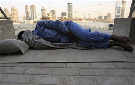 An impoverished foreign worker sleeps at a construction site in Dubai, UAE. Photo: Reuters/Ahmed Jadallah/File photo from Nov. 13, 2006. An impoverished foreign worker sleeps at a construction site in Dubai, UAE. Photo: Reuters/Ahmed Jadallah/File photo from Nov. 13, 2006.