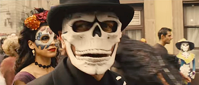 Daniel Craig and Stephanie Sigman wear skull masks in the opening Day of the Dead sequence of "Spectre." Screenshot from the movie's official trailer.