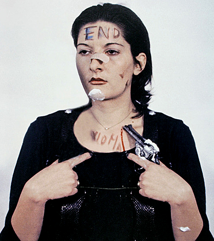 Marina Abramović during 1974 "Rhythm 0" performance, photographer unknown.