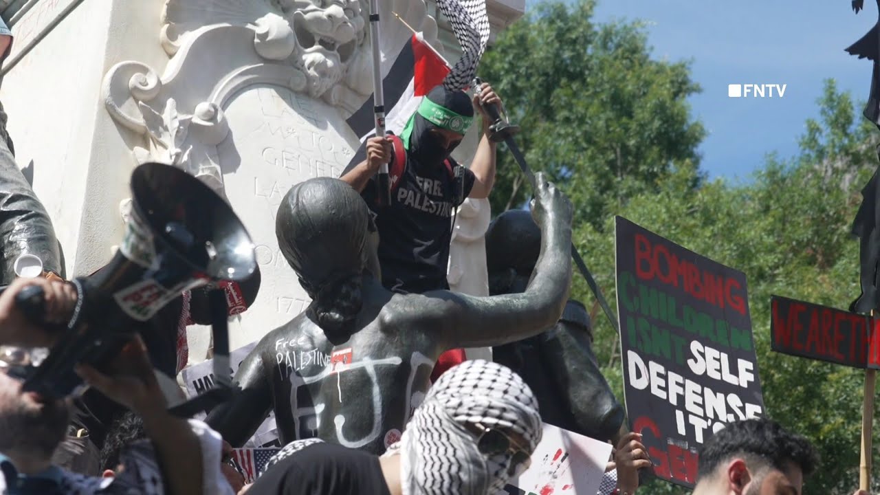 Bloody Mask of Biden held up by Protestor as "FJB" tagged on Statue and US flag set on fire DC