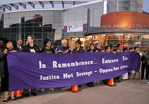 Hundreds of people gathered on the grounds of the Japanese American National Museum on Sept. 9, 2010, for a candlelight vigil in support of the constitutional rights of Muslim Americans. The banner reads, "In Remembrance… Embrace Life. Justice Not Revenge - Oppose Hate Crimes." Photo by Mark Vallen ©. 