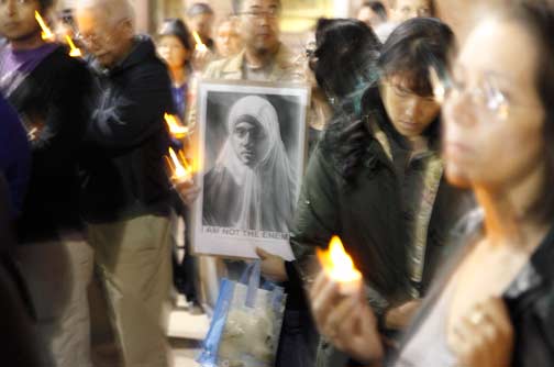 Around 200 people filled the Japanese American National Museum plaza for the silent, candlelight vigil. Photo by Mark Vallen ©.