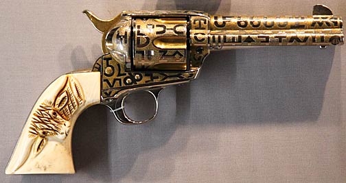 Colt Single Action Army revolver. This lavishly engraved .45 cal pistol belonged to Captain Manuel Gonzaullas of the Texas Rangers in 1929. Gonzaullas was the first Latino to become a high ranking officer in the Texas Rangers. First introduced in 1873, the Colt 45 became known as "the handgun that won the West." Photo by Mark Vallen ©.