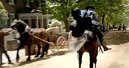 "As Revere rides his steed through the village while shouting 'The Italians are coming!' and the FIAT 500Ls enter the township, something odd stirs in the settlement." Screenshot from Fiat's Italian Invasion commercial.