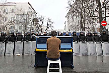  Chopin Performance. 2013. Mariyan Mitsik. As mentioned in the ARTnews article, Icons on the Barricades, Mitsik performed in the streets at a piano painted in the colors of the Ukrainian flag.