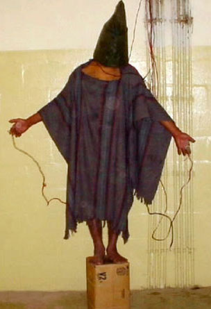 This 2003 photo taken by a U.S. military guard at Abu Ghraib prison, shows the torture of an Iraqi prisoner.
