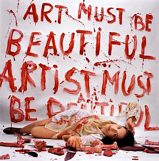 "Art Must Be Beautiful, Artist Must Be Beautiful." Photo commemorating Abramović's 1975 performance piece of the same name. 