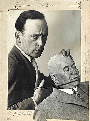John Heartfield created this self-portrait photomontage showing him scissoring off the head of Berlin Police Commissioner Karl Zörgiebel. Published in Arbeiter-Illustriete Zeitung (AIZ, or "Worker's Illustrated Paper") in 1929.