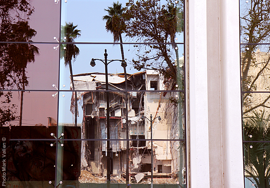 "Reflections." Across the street from LACMA is the 5900 Wilshire skyscraper; my photo captures the museum reflected in the skyscraper’s windows. Marking the 1989 demolition of the Berlin Wall, 10 original segments of the Wall were installed at the 5900 in 2009. Ironic that LACMA and the Berlin Wall are both gone. Photo Mark Vallen ©. Sept 13 2020.