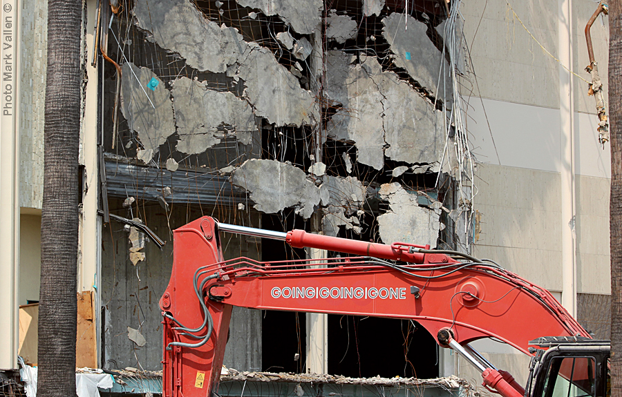 "Going, Going, Gone." Emblazoned on the wrecking crane slamming the facade of LACMA’s Ahmanson Building is the slogan of GGG Demolition Inc., the company that conducted the destruction of the museum. Aptly enough, the three Gs stand for "Going, Going, Gone." Photo Mark Vallen ©. Sept 13 2020.