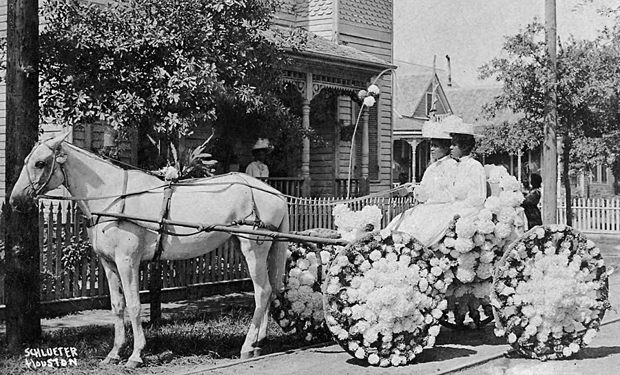 Two women sitting in a buggy decorated with flowers at the annual Juneteenth Emancipation Day celebration in Houston, Texas, 1906. Left to right: Martha Yates Jones and Pinkie Yates. Source: Houston Public Library Digital Archives.